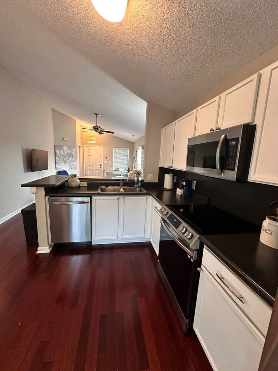 Fully equipped kitchen with stainless steel appliances and everything you need to cook real meals