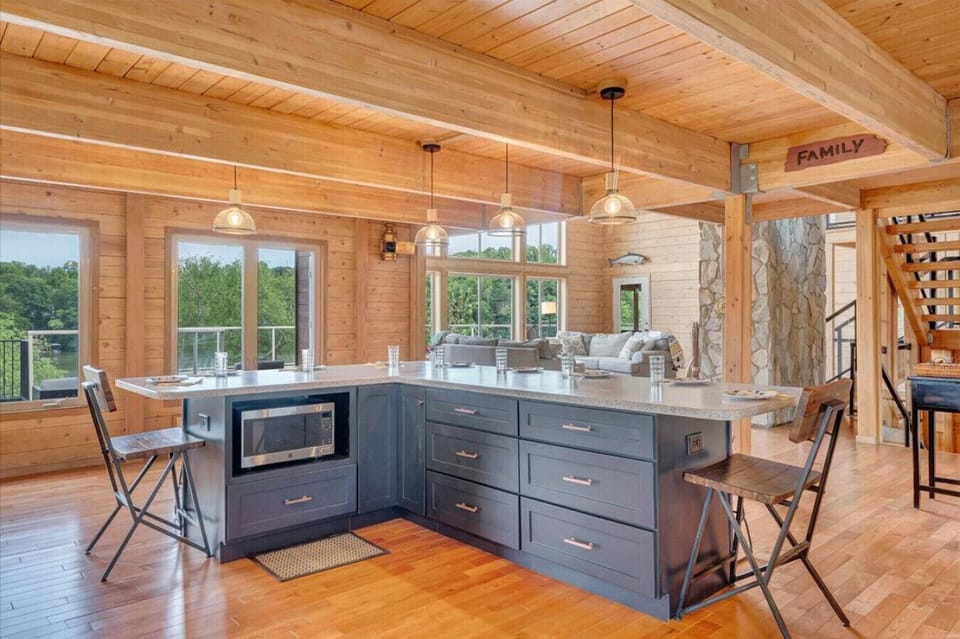 Large open kitchen and bar area between the dining room and living room