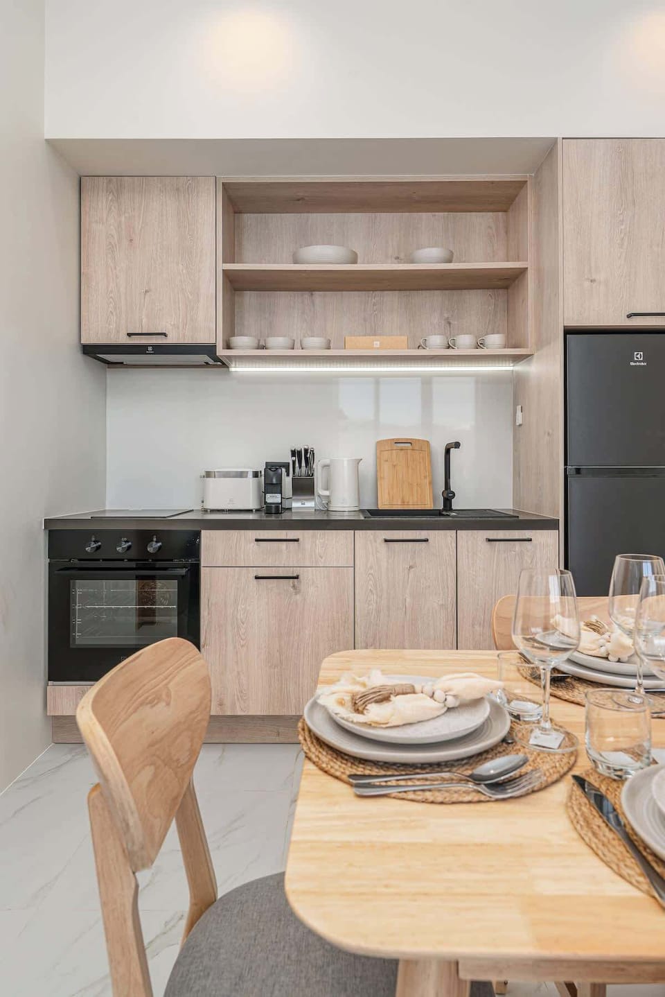 The villa features a fully equipped kitchen including induction stove, oven, refrigerator, freezer, kitchenware, cooking equipment and a set of cooking essentials, such as salt, pepper, olive oil. 