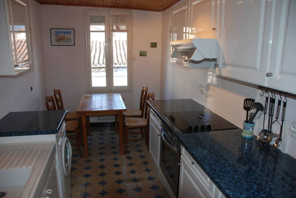 Additional Kitchen on 2nd floor. Electric Stove, Washing Machine & Seating area.