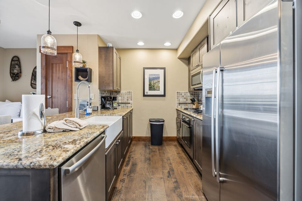 Fully Equipped Galley Kitchen with Stainless Appliances
