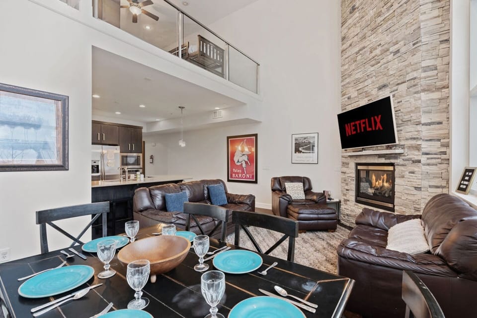 Gather around the dining table for meals and laughter! With seating for six and extra spots at the kitchen counter, plus a patio with a grill! | Giant Steps Retreat, Brian Head, Utah | Voyax Luxury Vacation Rentals