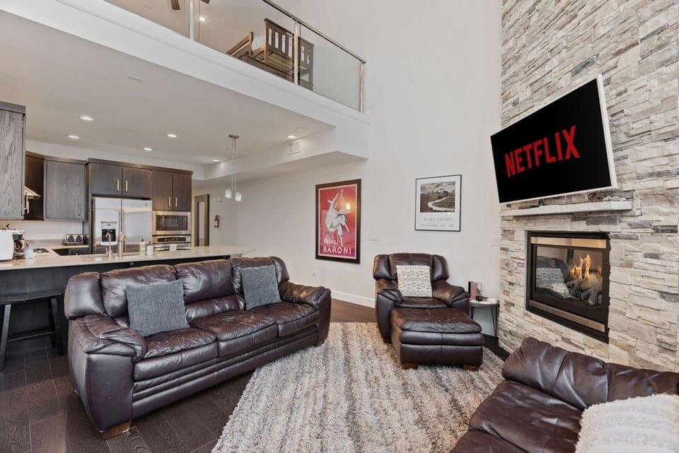 Enjoy comfy seating in the cozy living room, complete right next to the fully equipped kitchen! | Giant Steps Retreat, Brian Head, Utah | Voyax Luxury Vacation Rentals