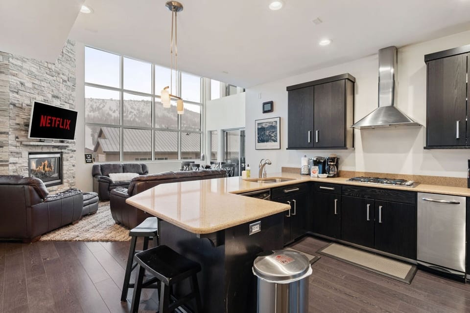 Cook up a storm in the fully equipped kitchen, complete with everything you need for delicious meals and snacks! Perfect for gathering with family and friends. | Giant Steps Retreat, Brian Head, Utah | Voyax Luxury Vacation Rentals