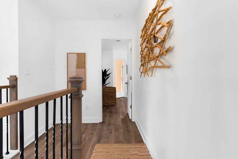 Explore the second-floor hallway, where more cozy rooms await for your perfect getaway! | White Sands, Paradise Isles, Destin | Voyax Luxury Vacation Rentals