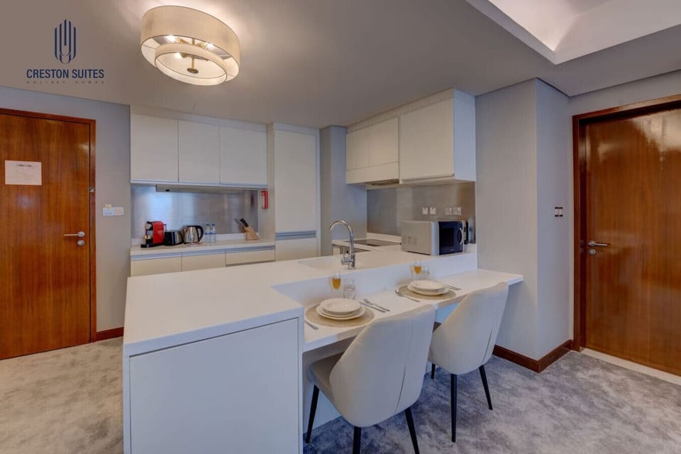 The kitchen and dining area layout and furnishings may vary slightly between rooms, yet each offers a stylish, comfortable, and well-appointed setting for your stay