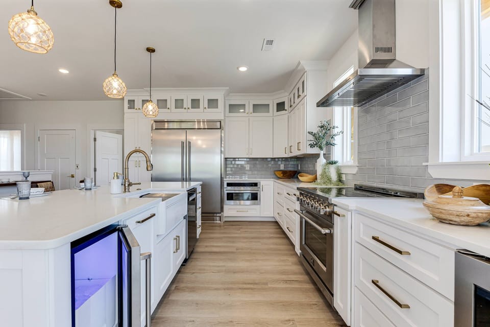 Chef's kitchen with upscale appliances, an under the counter filtered water ice maker. Lots of space to prep & serve delicious meals.