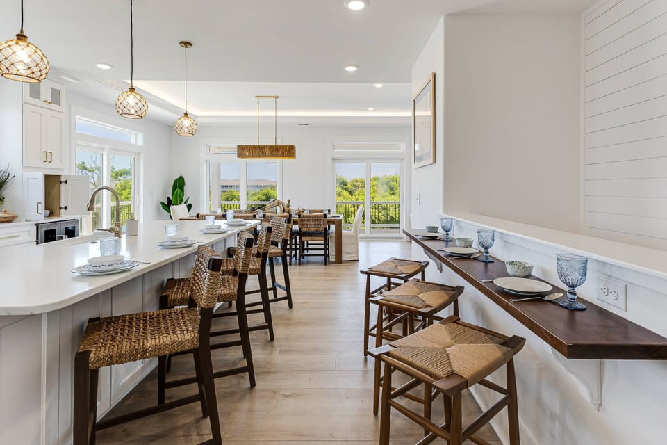 There is additional seating at the large kitchen island & side bar.