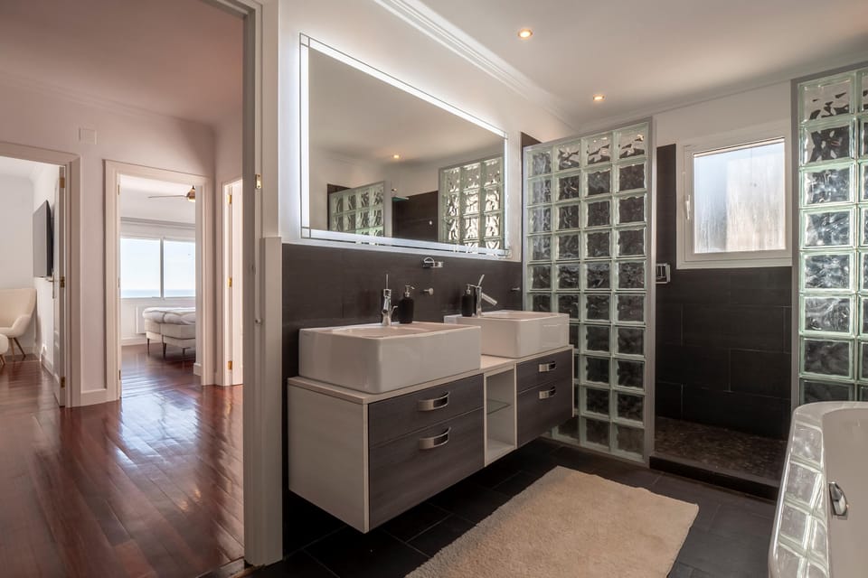 Bathroom with bath and shower
