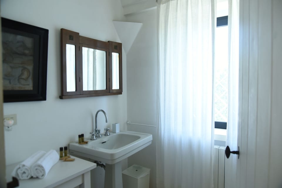 Deluxe Apartment, Patio | Bathroom | Hair dryer, bidet, towels, soap