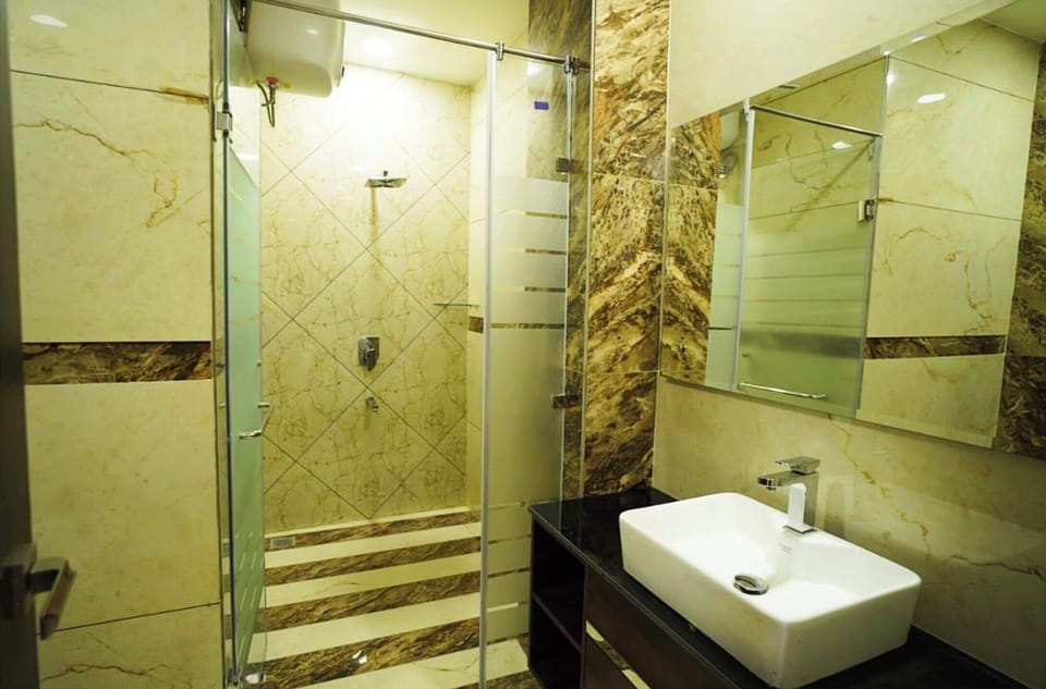 Deluxe Double Room, City View | Bathroom | Shower, free toiletries, slippers, soap