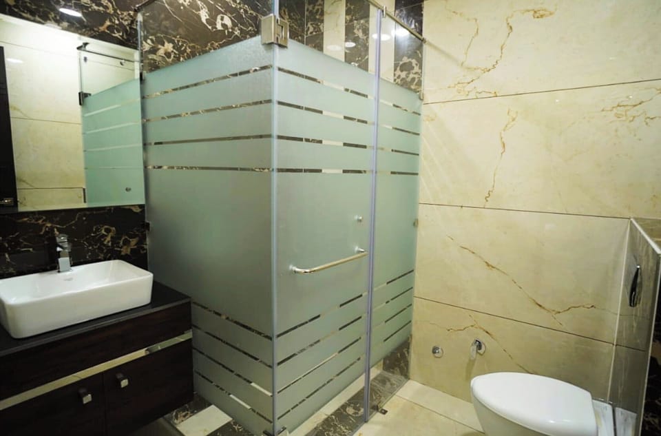 Shower, free toiletries, slippers, soap