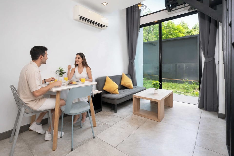 Design Condo, 1 Bedroom, Balcony | Living area | 36-inch flat-screen TV with cable channels