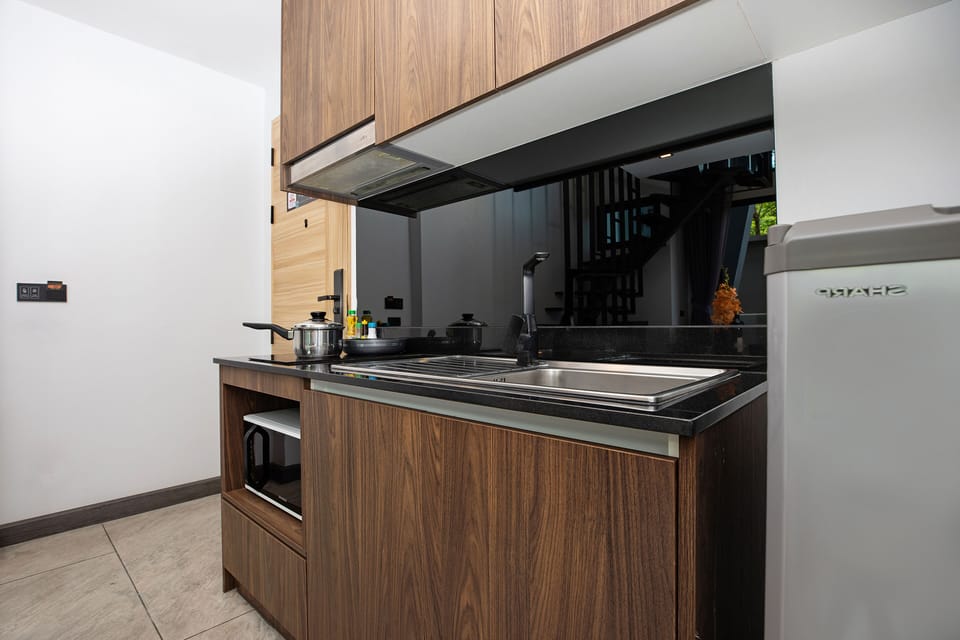 Design Condo, 1 Bedroom, Balcony | Private kitchen | Electric kettle