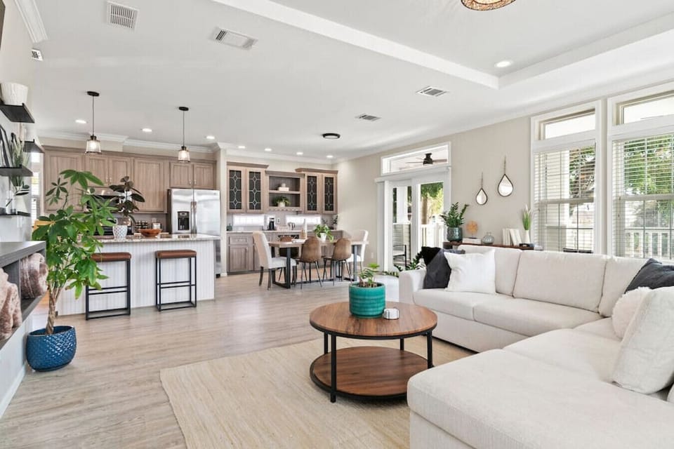 Another perspective of the open living area showcases the easy connection between the kitchen, dining, and relaxing zones.

