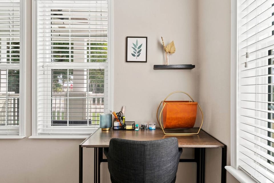 Bright home office nook offers a dedicated workspace with natural light streaming through the window and stylish accents.