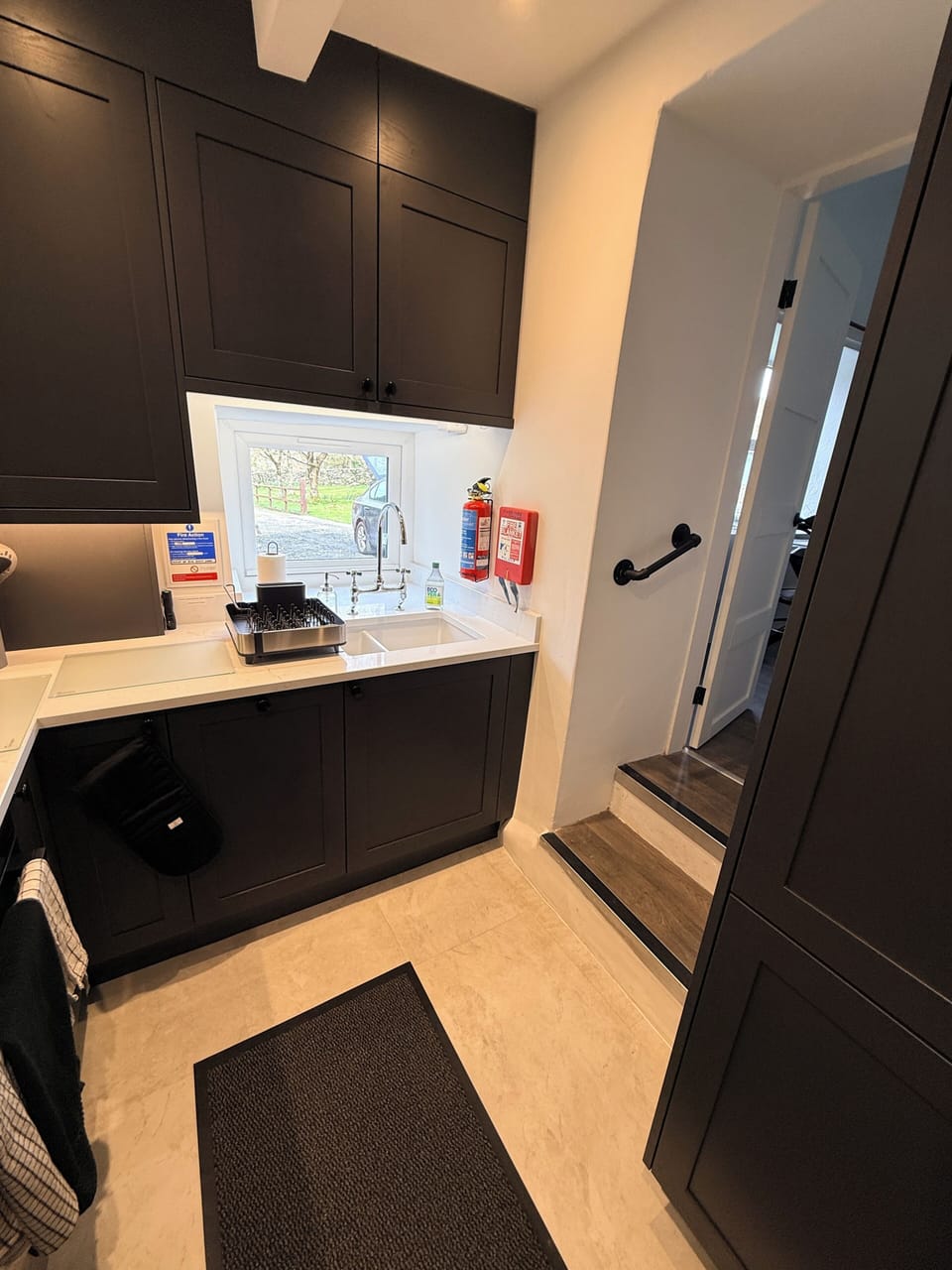 Steps from living room into the kitchen