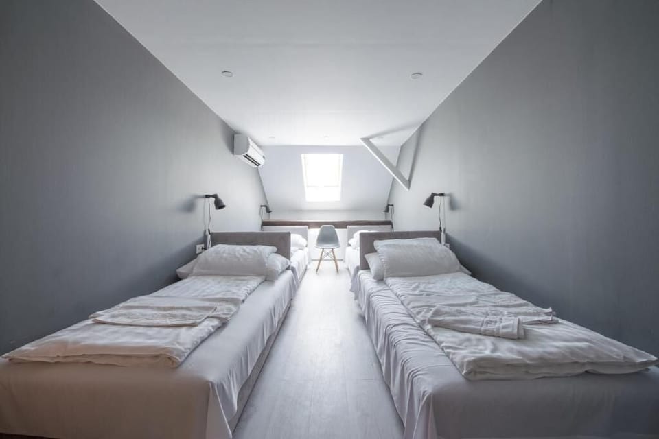 Quadruple Room | Minibar, in-room safe, desk, laptop workspace
