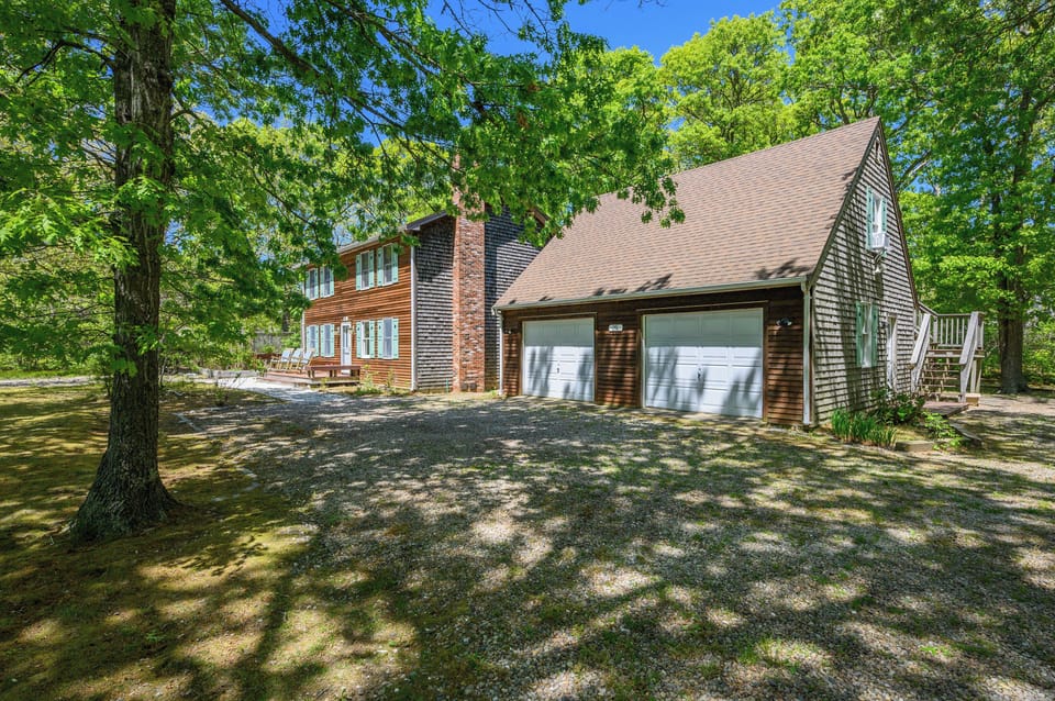 Exterior driveway view showing Treehouse garage and main house 