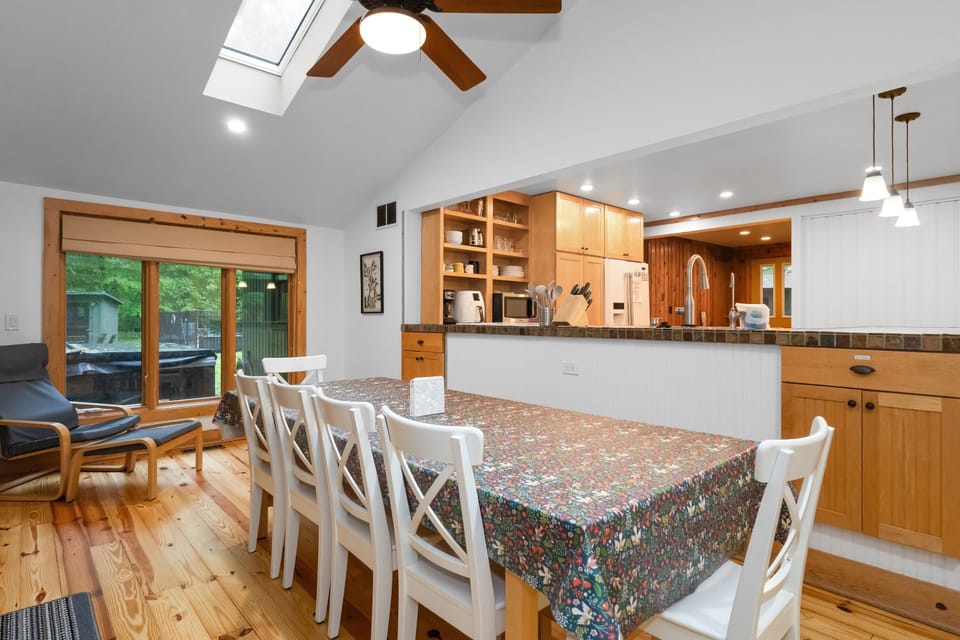 Spacious dining table seats eight—perfect for family meals and group gatherings.K