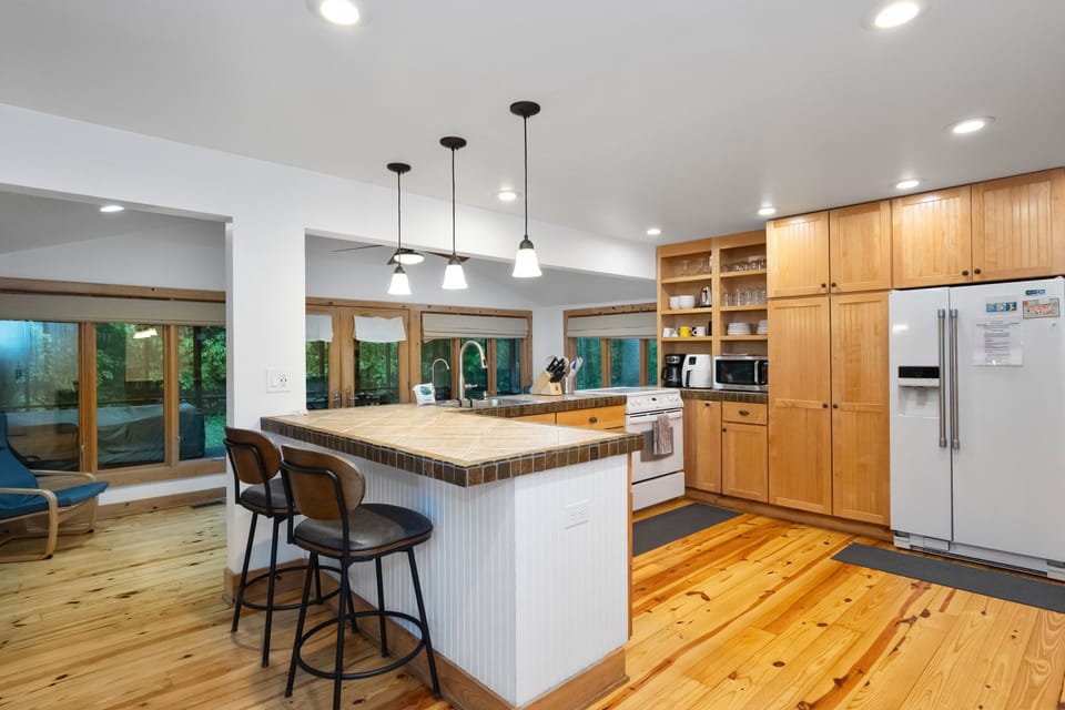 Kitchen peninsula with barstools offers extra seating—perfect for casual meals or keeping the cook company.