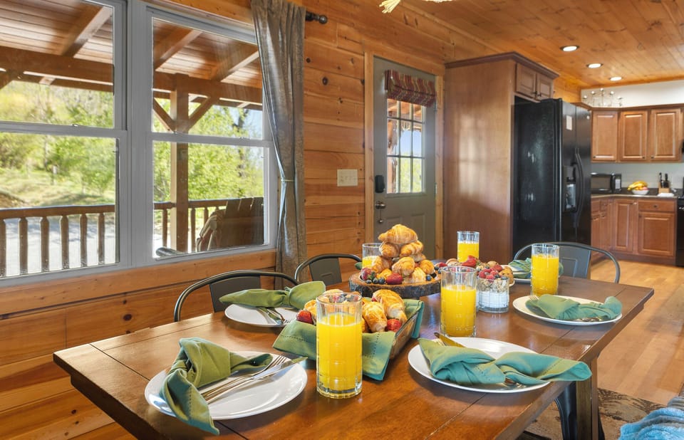 Dining Room: Sun-drenched space for delightful meals with mountain views and fresh, local flavors!
