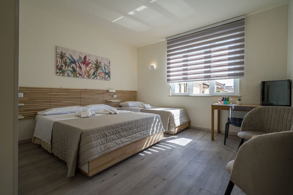 Family Triple Room, Ensuite, City View | Premium bedding, memory foam beds, minibar, laptop workspace