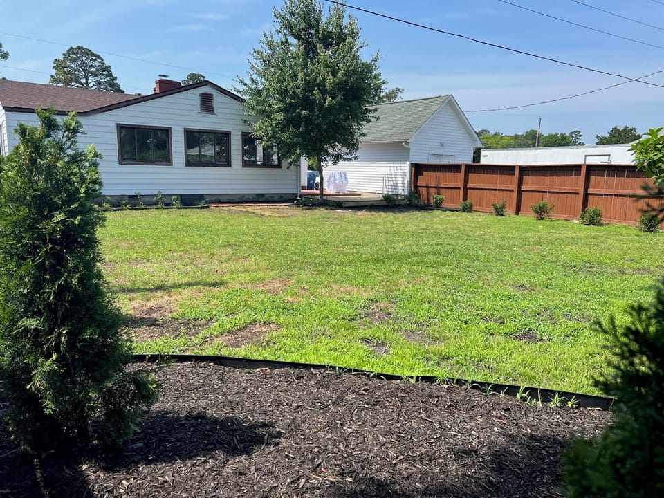 Back of home and private backyard.