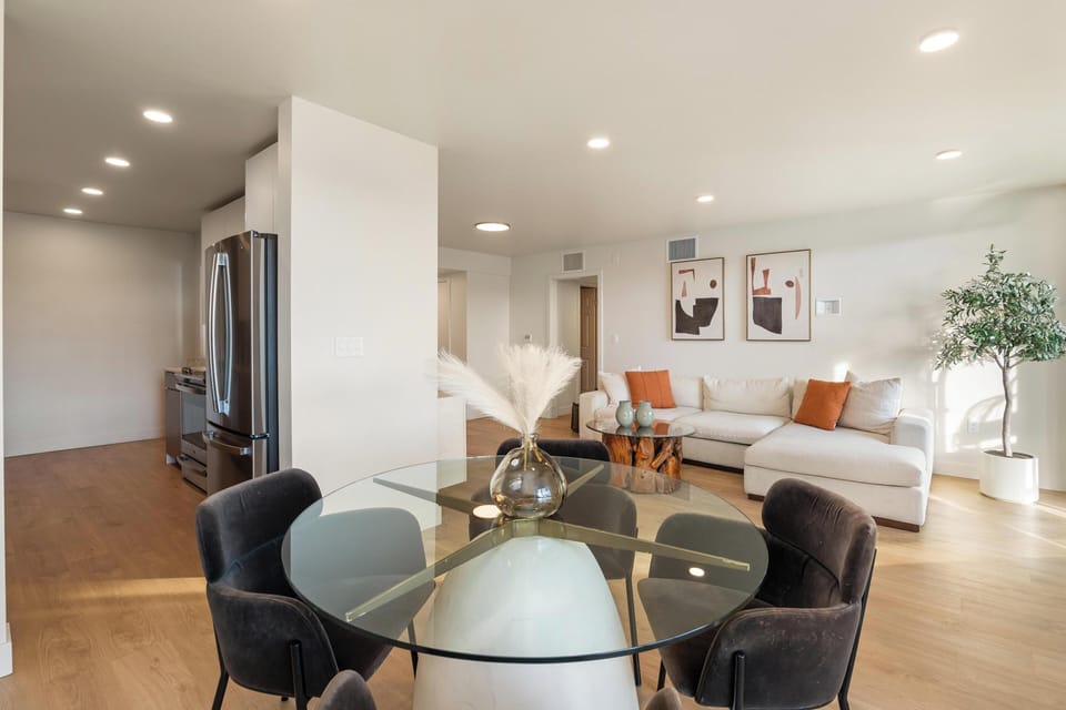 Modern open layout with designer furniture and soft natural light