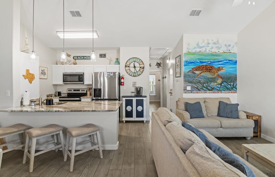 Plenty of seating in open concept living space and dining area/kitchen