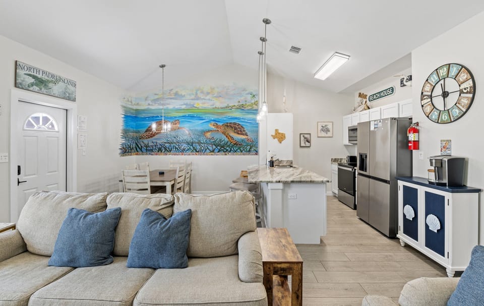 Open concept living area and kitchen for gatherings. Plus a coffee bar.