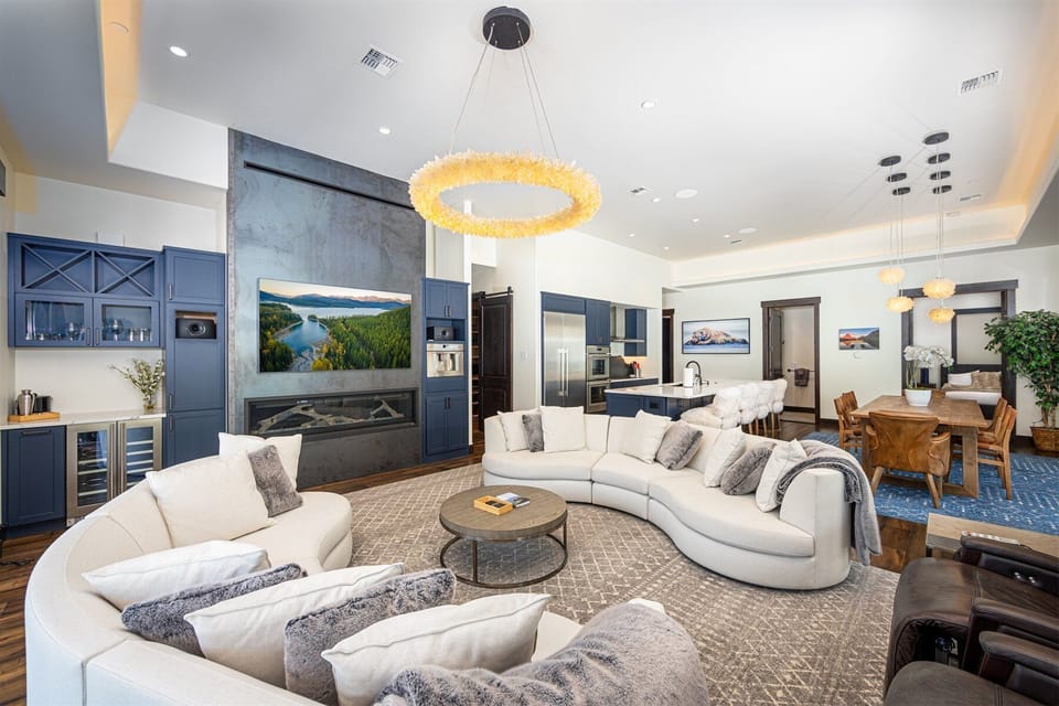 The open concept living area is embellished with custom lighting | Main Level
