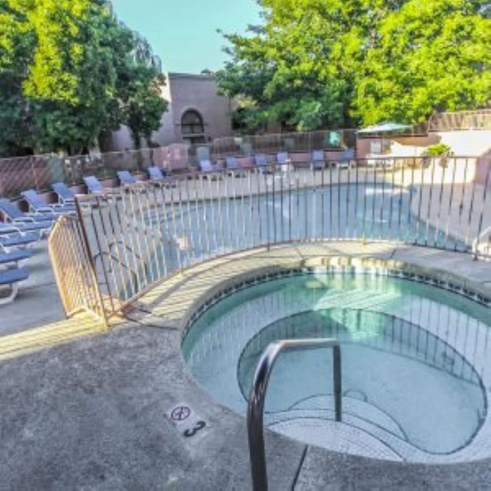 Hot Tub Area – A detailed look at the hot tub, perfectly situated for leisure, with ample seating surrounding it.