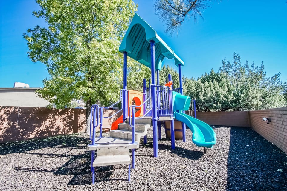 Playground Fun – Perfect for family living, this vibrant playground invites children to explore, play, and enjoy the outdoors in a safe, spacious environment.