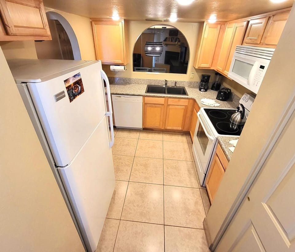 This fully equipped kitchen features modern appliances and ample counter space, making cooking a delightful experience amidst your stay.