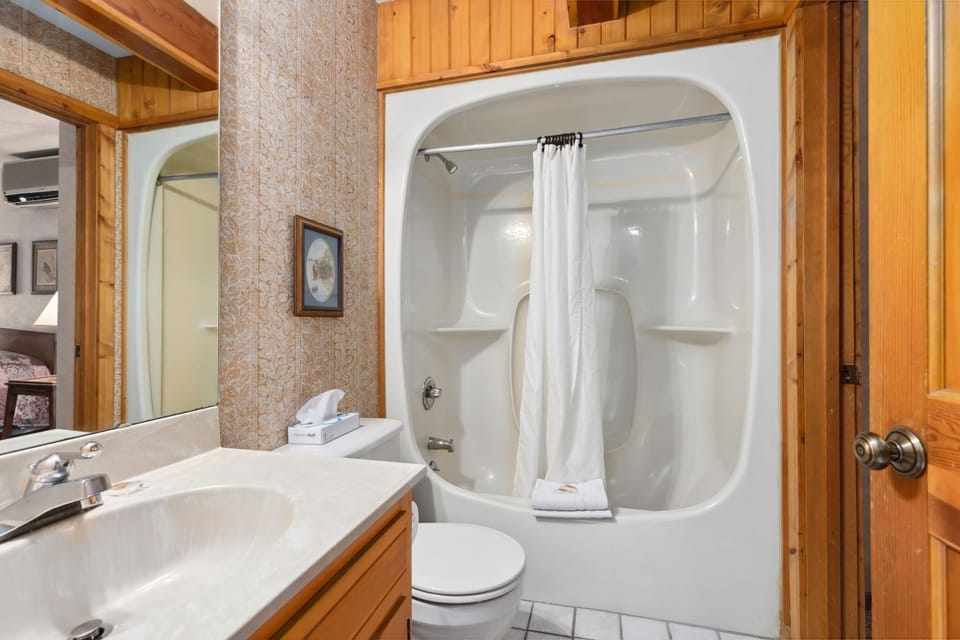 The second bathroom offers a modern touch, ensuring convenience for guests or family members.