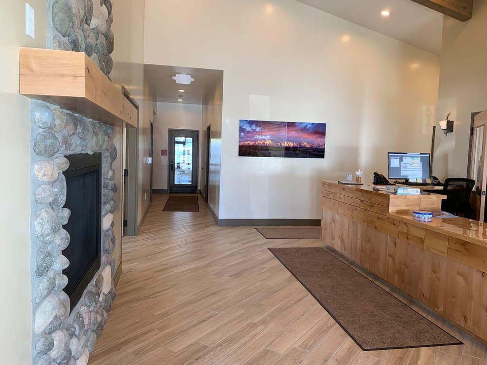 The warm and welcoming lobby area showcases rustic charm and modern amenities, perfect for gathering and planning your next adventure.