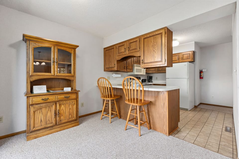 Functional kitchen with wooden cabinetry and ample counter space.
