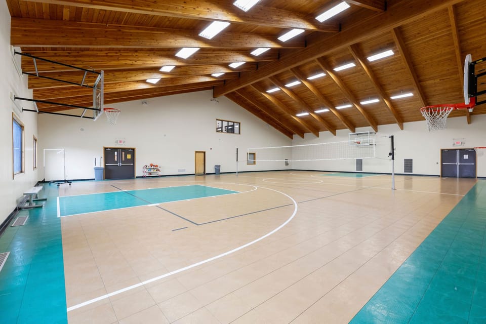 Full-size indoor basketball court for year-round recreation.