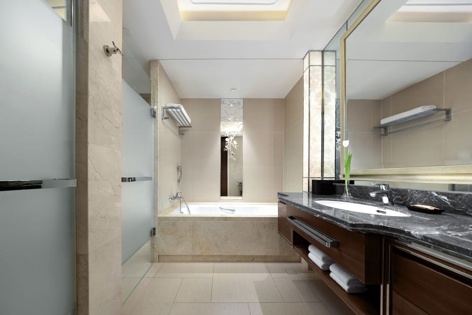 Separate tub and shower, hair dryer, bathrobes, slippers