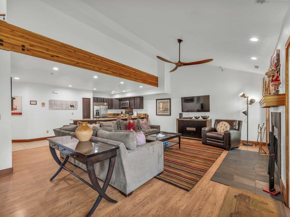 Living room 1: Main floor, wood-burning fireplace, Smart TV, large sectional sofa