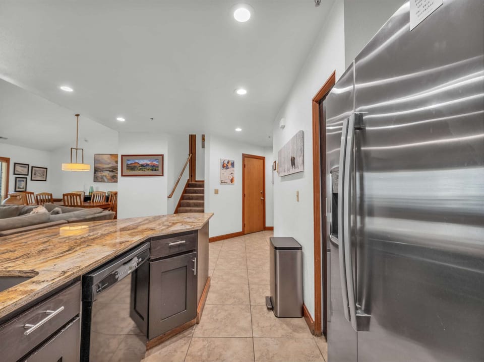 Kitchen: Main floor, drip coffee maker, Keurig, toaster, cooking utensils, tableware

