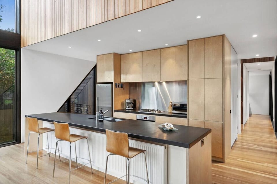 Modern luxury. Designer kitchen and dining space that opens to the deck for effortless entertaining.