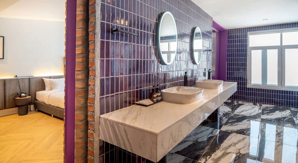 Superior Suite, 1 King Bed, Non Smoking | Bathroom | Separate tub and shower, hair dryer, towels, soap