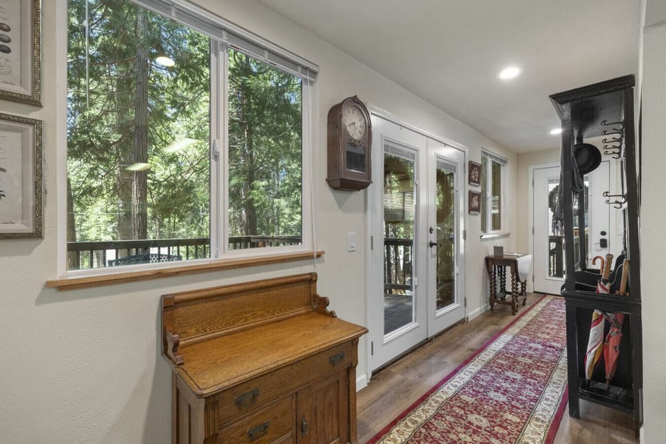 Nana’s eye for comfort and charm shines here—sunlight pours through the entryway windows, highlighting one of her favorite hand-picked pieces.