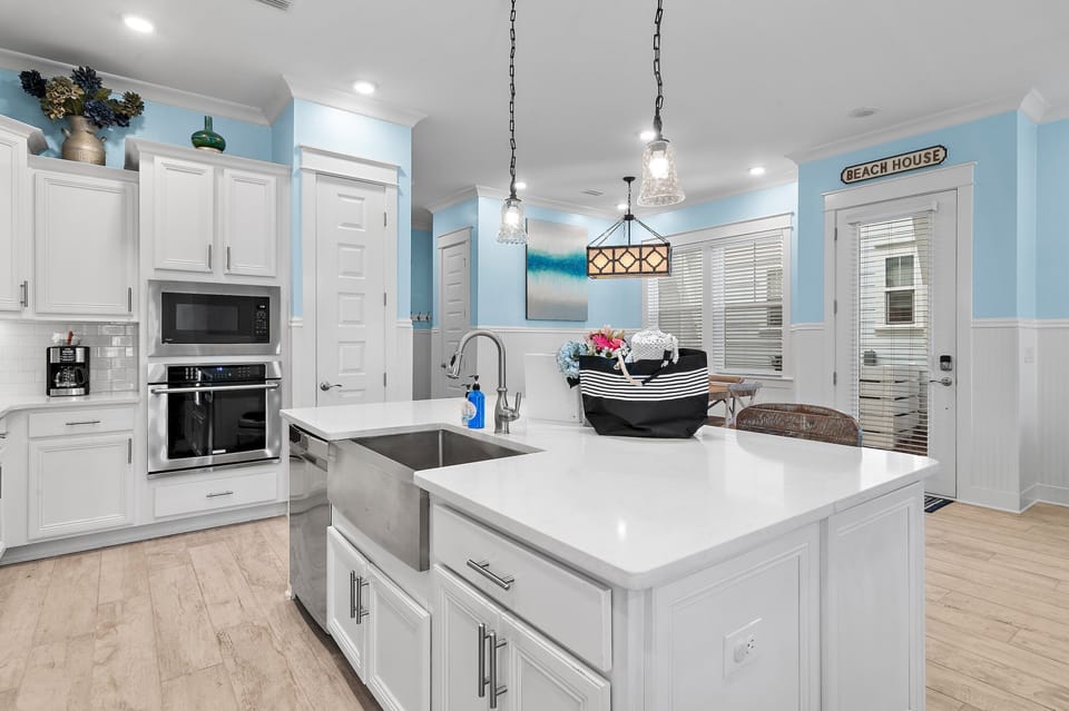 Gather around the oversized island with seating, perfect for morning coffee and easy meals.