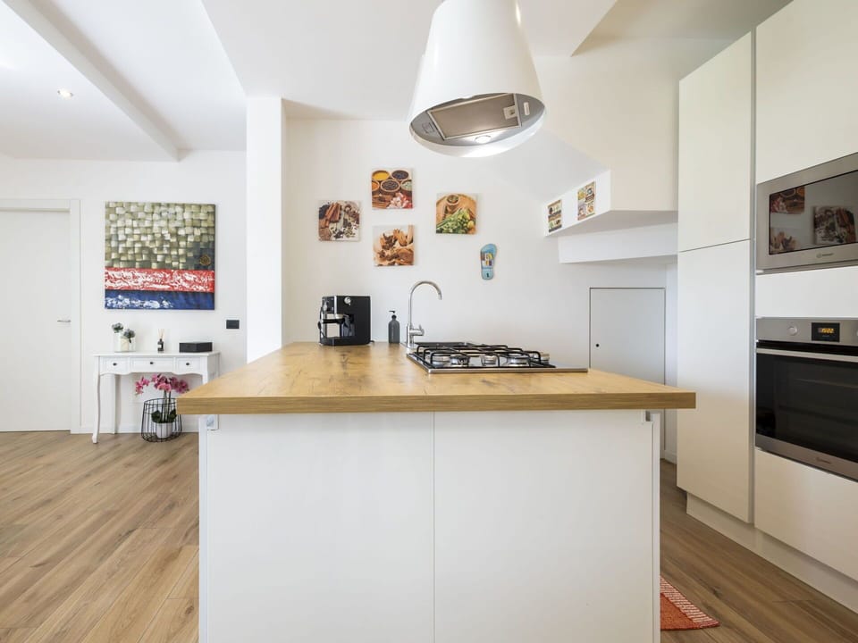 Kitchen, Kitchen Appliance, Countertop, Furniture, Interior Design, Flooring, Major Appliance, Cabinetry, Floor, Wood