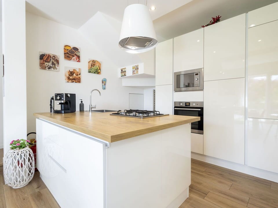 Kitchen, Countertop, Kitchen Appliance, Cabinetry, Flooring, Interior Design, Furniture, Major Appliance, Wood, Floor