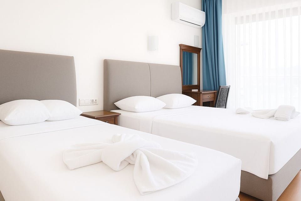 Standard Room | Minibar, in-room safe, free cribs/infant beds, WiFi