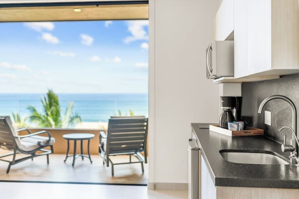 Even with its compact design, the kitchenette is well-equipped to cater to essential culinary needs.